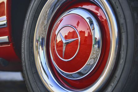 Mercedes Benz logo on vintage car wheel. Mercedes-Benz is a German automobile manufacturer. The...
