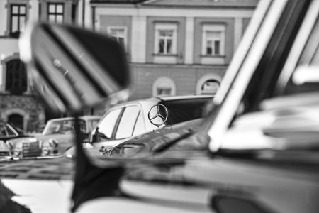 Mercedes Benz logo on vintage car. Mercedes-Benz is a German automobile manufacturer. The brand is...