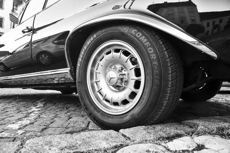 Mercedes Benz logo on vintage car wheel. Semperit logo on tyre. Mercedes-Benz is a German automobile manufacturer. The brand is used for luxury automobiles, buses, coaches and trucks. Black white image.のeditorial素材