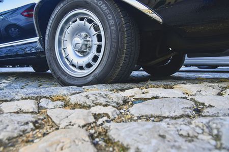 Mercedes Benz logo on vintage car wheel. Semperit logo on tyre. Mercedes-Benz is a German automobile manufacturer. The brand is used for luxury automobiles, buses, coaches and trucks.のeditorial素材