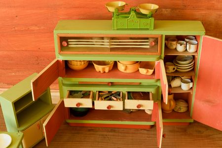Vintage toys for girls. Wooden toy kitchenの写真素材