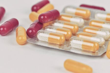 Assorted pharmaceutical medicine pills and capsules. Pills background. Heap of assorted various...