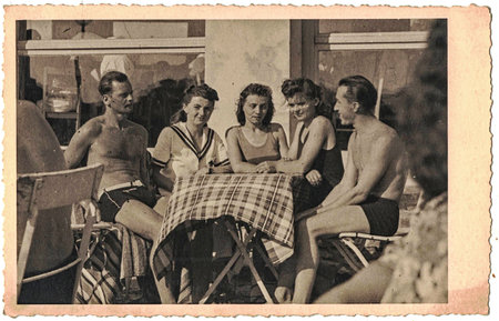 Retro photo shows group of young people somewhere in summer time. Spa resort.のeditorial素材