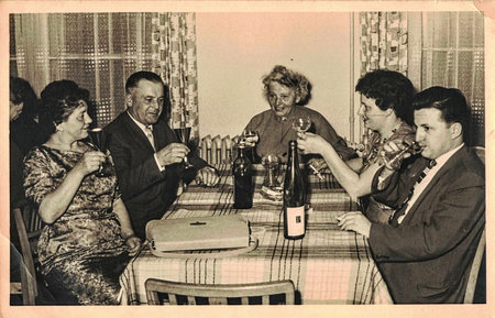 Retro photo shows social event - celebrating of New Years Eve. Circa 1950s.のeditorial素材