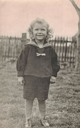 Vintage photo shows a cute small boy, wears a sailor dress. Black and white photographyのeditorial素材