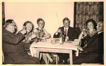 Retro photo shows social event - celebrating of New Years Eve. Circa 1970s.のeditorial素材