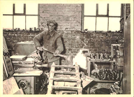 FRAUREUTH, EAST GERMANY - MARCH 3, 1965: Worker in factory. Retro photo from former East Germany.
