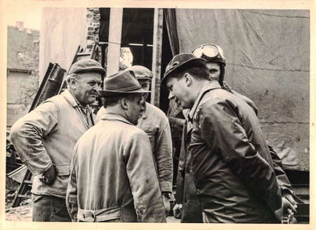 FRAUREUTH, EAST GERMANY - MAY 21, 1965: Retro photo shows workers at construction site. Vintage...