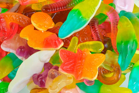 Assorted tasty gummy candies. Top view. Fruit gummy candies backgroundの写真素材