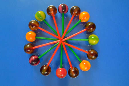 Mix of colorful lollipops. Children lollipops on a pastel background. Copy space, flat lay....
