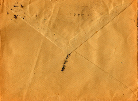 Back of an old used envelope. Rich stain and paper details. Can be used as background.の写真素材