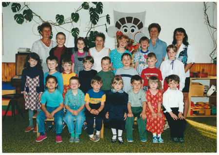 THE CZECHOSLOVAK REPUBLIC - CIRCA 1990s: Retro photo shows children pose in the kindergarten - nursery with female teachers. Vintage color photography. Circa 1990.のeditorial素材