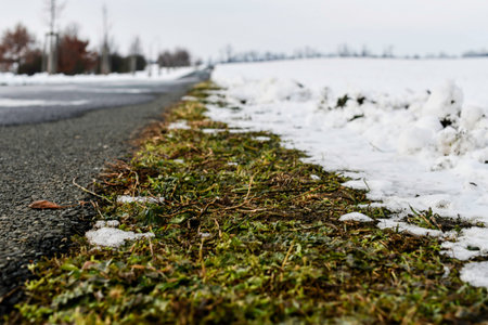 Road plowed through by snow plow in winter. Roads plowed in winter. Concept of winter and winter...