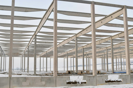 A built-up factory hall in winter. Work site during winter. The concept of the finish of the project...