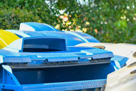 View of garbage bins. View of colorful trash bins. Colorful trash containers. The concept of waste, sustainable living, and the environment.の写真素材