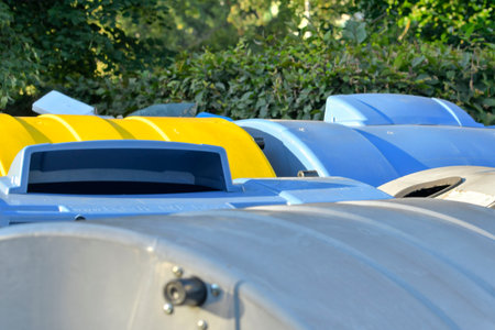 View of garbage bins. View of colorful trash dumpsters. Colorful trash containers. The concept of waste, sustainable living, and the environment.の写真素材
