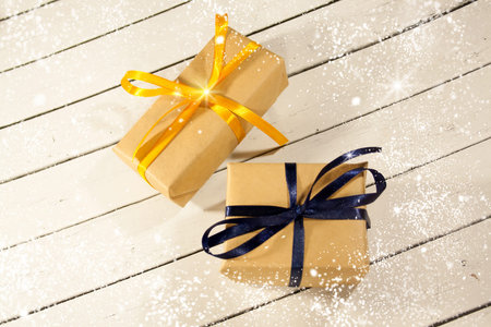New year and Christmas gift boxes in rustic style on a wooden wh