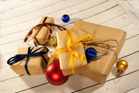 New year and Christmas gift boxes in rustic style on a wooden whの写真素材