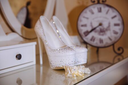 Elegant bridal accessories on white tableの写真素材
