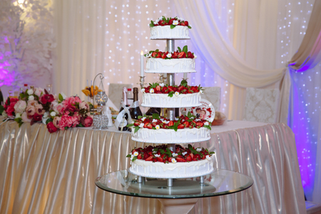 Sweets multilevel wedding cake decorated with flowersの写真素材