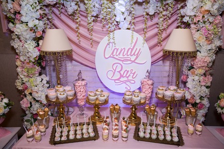Candy bar. Table with sweets, candies dessertsの写真素材