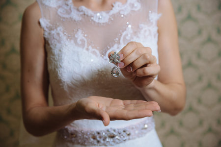 Earrind in the bride's handsの写真素材