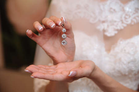 Earrind in the bride's handsの写真素材