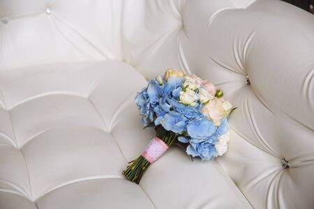 Wedding bouquet with blue flowers on the white backgroundの写真素材