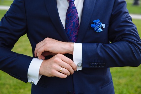 Business man hands with cufflinks. Elegant gentleman clotherの写真素材