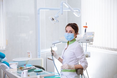Young woman dentist at work in the office. Concept healthyの写真素材
