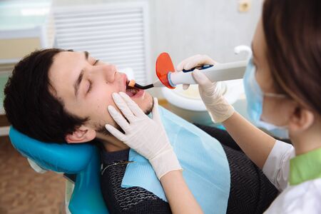 Young patient man in dentist office. Concept healthyの写真素材