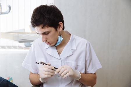 Professional dentist doing teeth checkup on female patient dental surgery. Concept healthyの写真素材