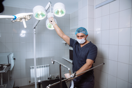 Surgeon holding medical instruments in hands. Concept of healthyの写真素材