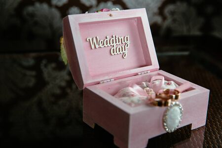 Two rings in a box with Wedding day inscription on the table. Concept of marriageの写真素材