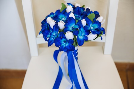 Wedding bouquet with blue flowers on the white backgroundの写真素材