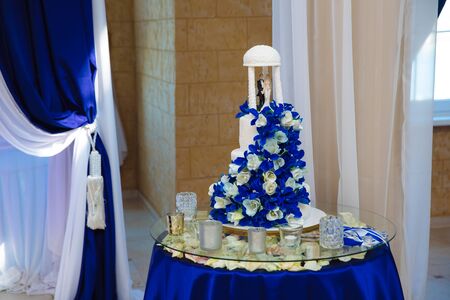 Sweets multilevel wedding cake decorated with flowersの写真素材