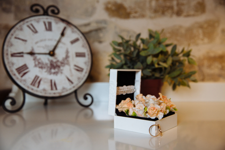 Wedding rings in a box on white table. Concept marriageの写真素材