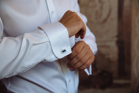 Business man hands with cufflinks. Elegant gentleman clotherの写真素材
