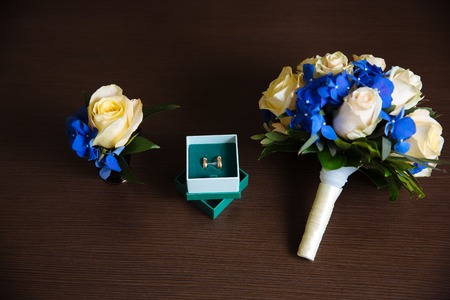 wedding bouquet, boutonniere gold ringsの写真素材