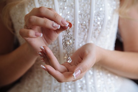 Earrind in the bride's handsの写真素材