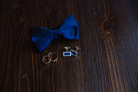 Men's accessories. Bow-tie, cufflinks, gold rings Groom detailsの写真素材