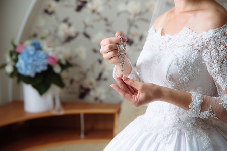 Earrind in the bride's handsの写真素材