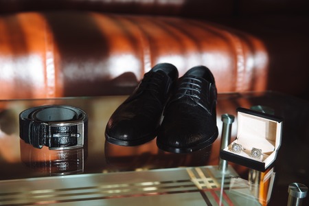 men's accessories, Cuff-links, shoes, strap on the tableの写真素材