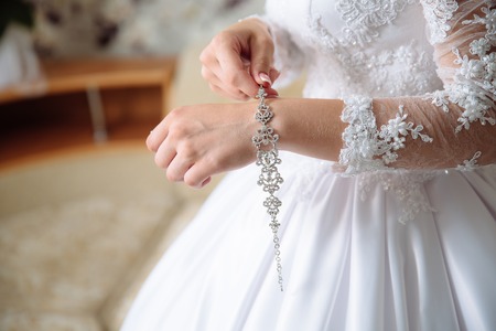 hands of the bride with the braceletの写真素材