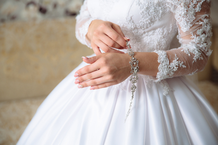 hands of the bride with the braceletの写真素材