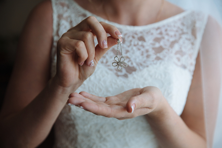 Earrind in the bride's handsの写真素材