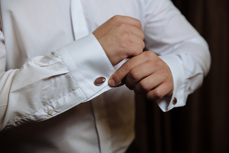 Business man hands with cufflinks. Elegant gentleman clotherの写真素材