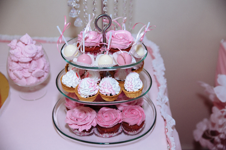 Wedding cake. Candy bar marshmallow on the table in a vase, macaroon, cake and cupcake, decor vanilla, handmade sweetの写真素材