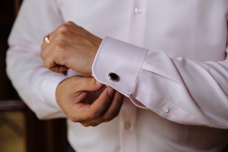 Business man hands with cufflinks. Elegant gentleman clotherの写真素材
