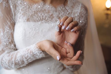 Earrind in the bride's handsの写真素材